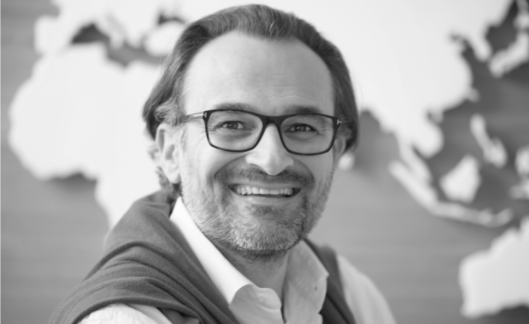 Close-up photo of Joerg Zeddies, a business leader in the telecommunications industry